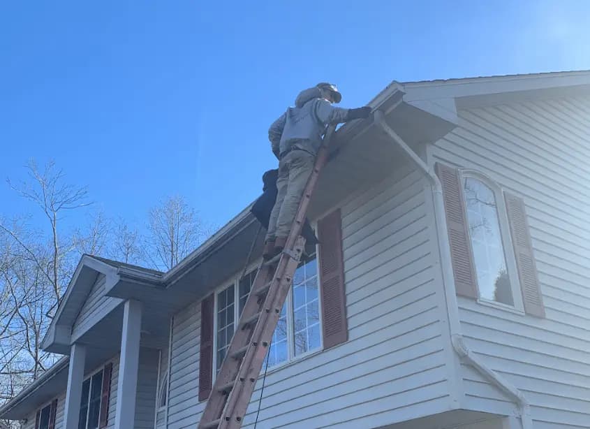 Gutter cleaning and maintenance being performed by Broadview Heights Power Washing in Broadview Heights